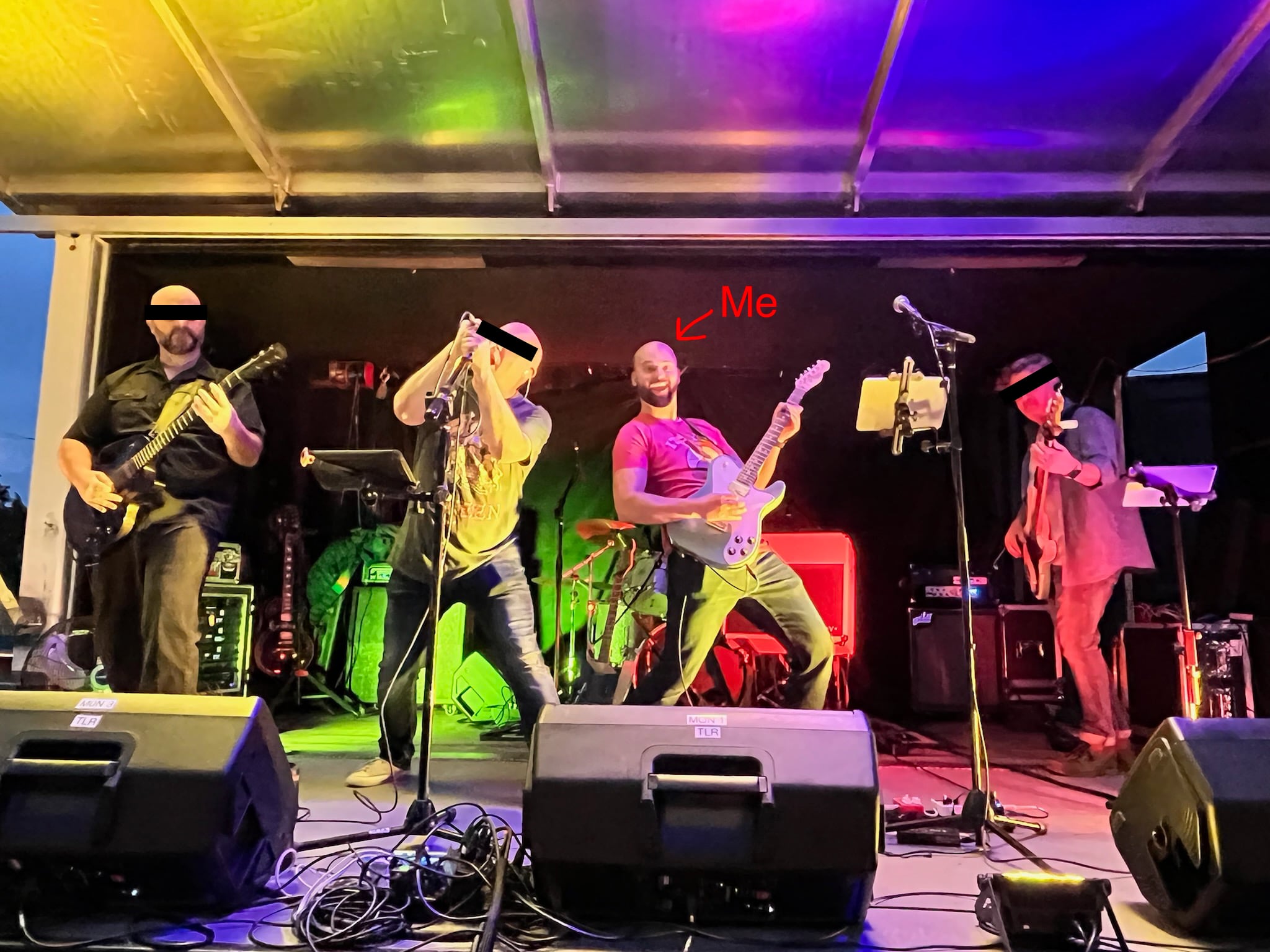 picture of Jared playing guitar on stage